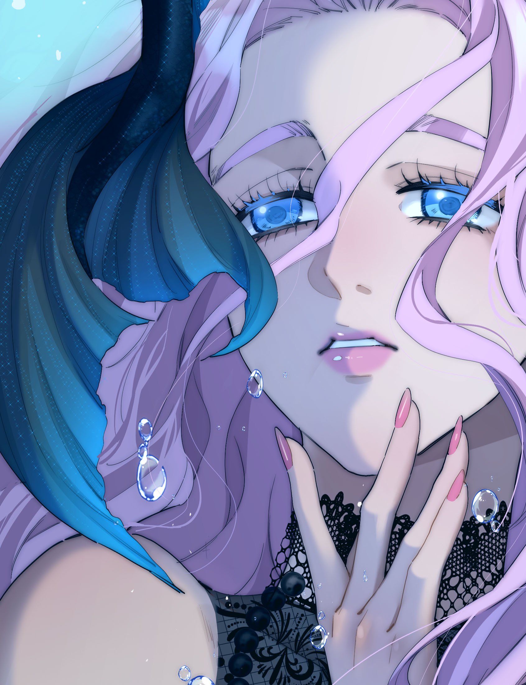 Ari faces the viewer underwater in a pearl-trimmed mermaid costume, with bright blue eyes and flowing pink hair.