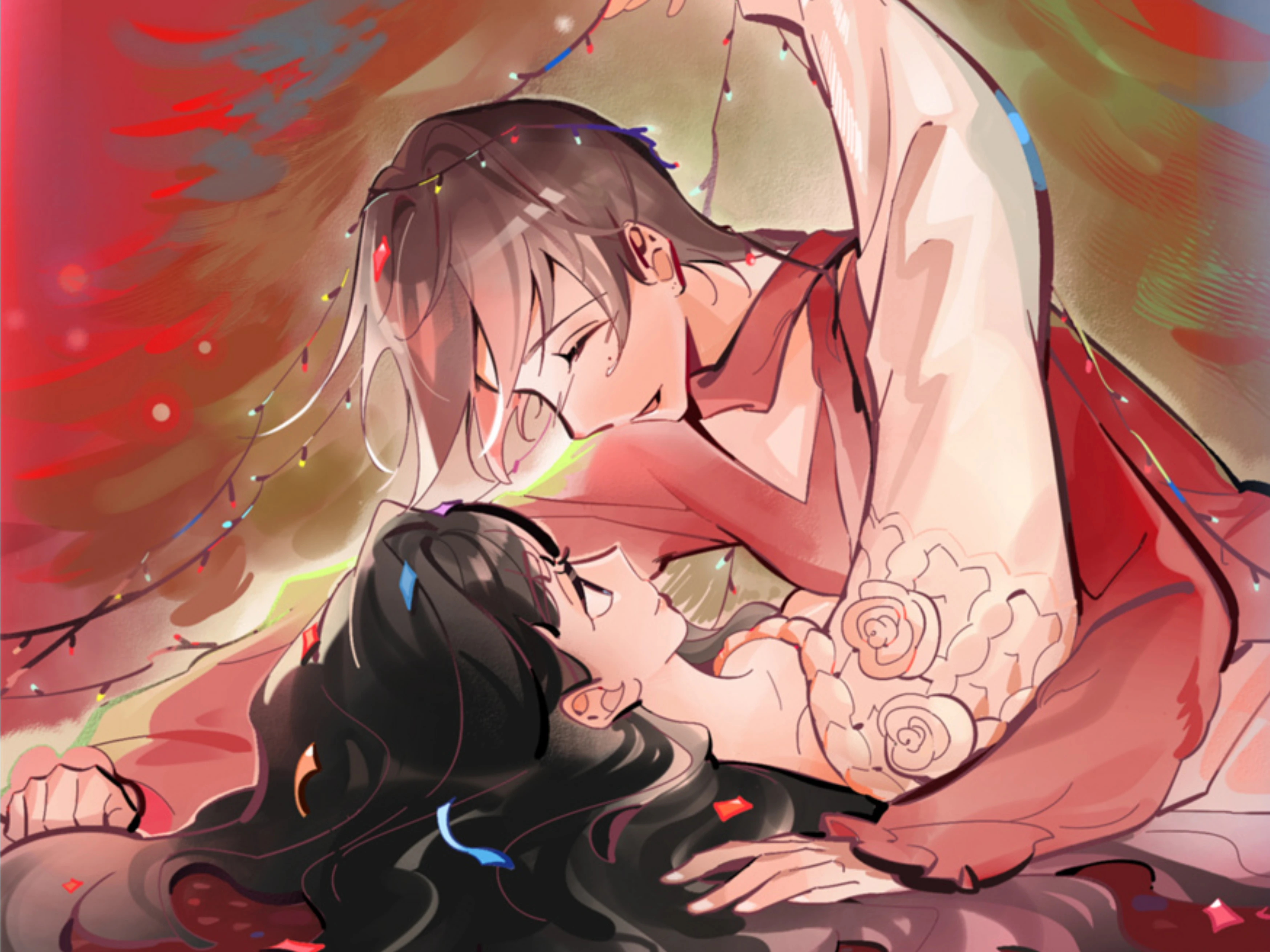 Two women lying close under strings of lights